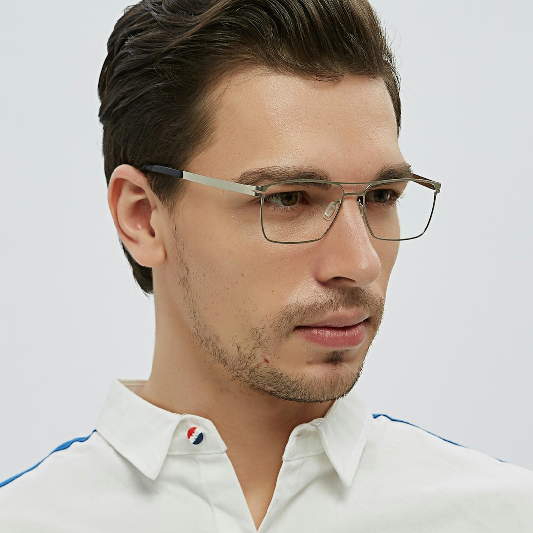 Professional studio portrait of a middle-aged Belgian man with glasses